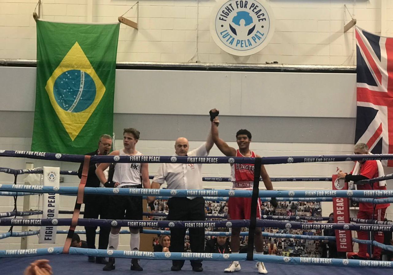 Jacob Johnson celebrating in a boxing ring