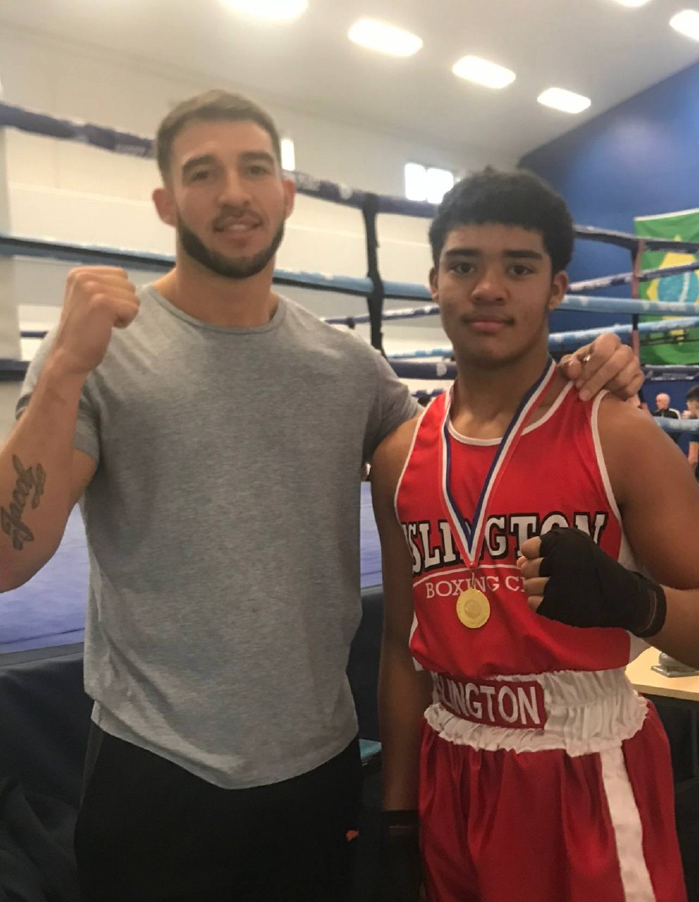Simon Johnson with a young athlete, representing mentorship and family development